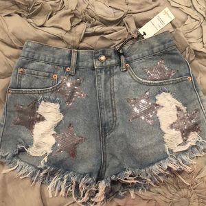 Blue jean shorts with silver sequin stars